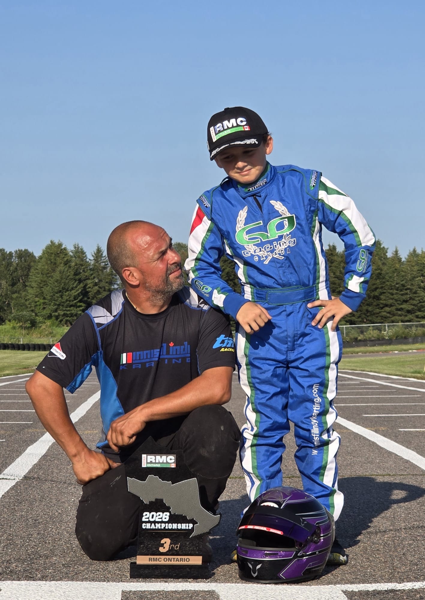 Angelo Launi with his father and mechanic Frank Launi following his 2026 RMC Ontario championship podium