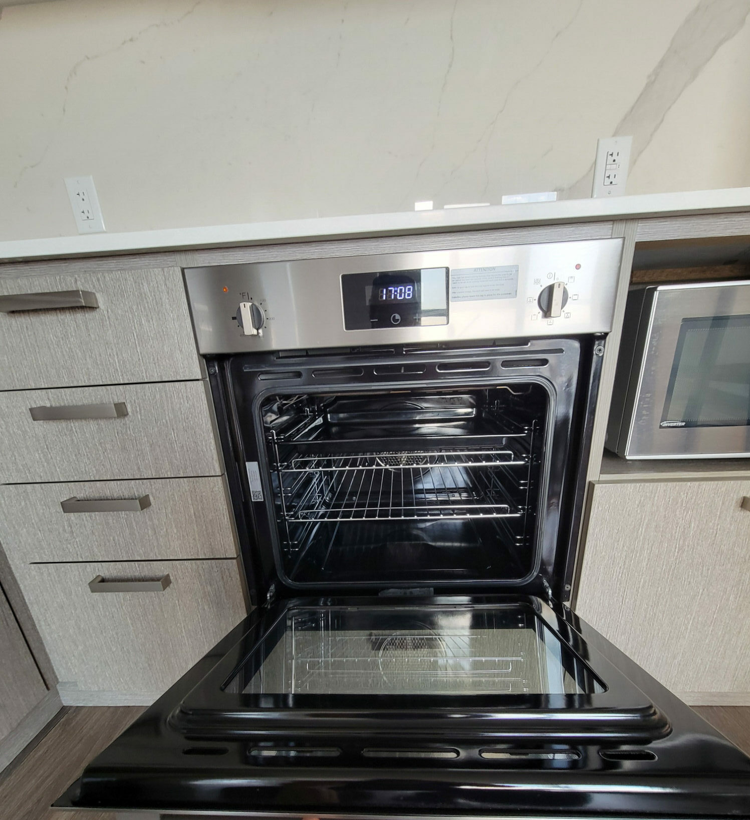Open oven detail on a service that includes interior appliance work